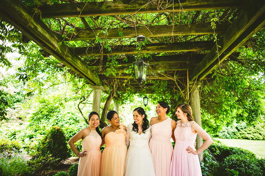 bride with her bridesmaids laughing